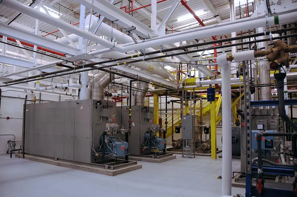 Industrial machinery and pipes in factory
