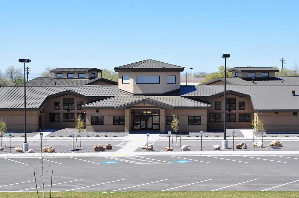 Modern building with empty parking lot.
