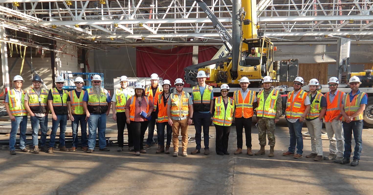 Construction team in safety vests and helmets.