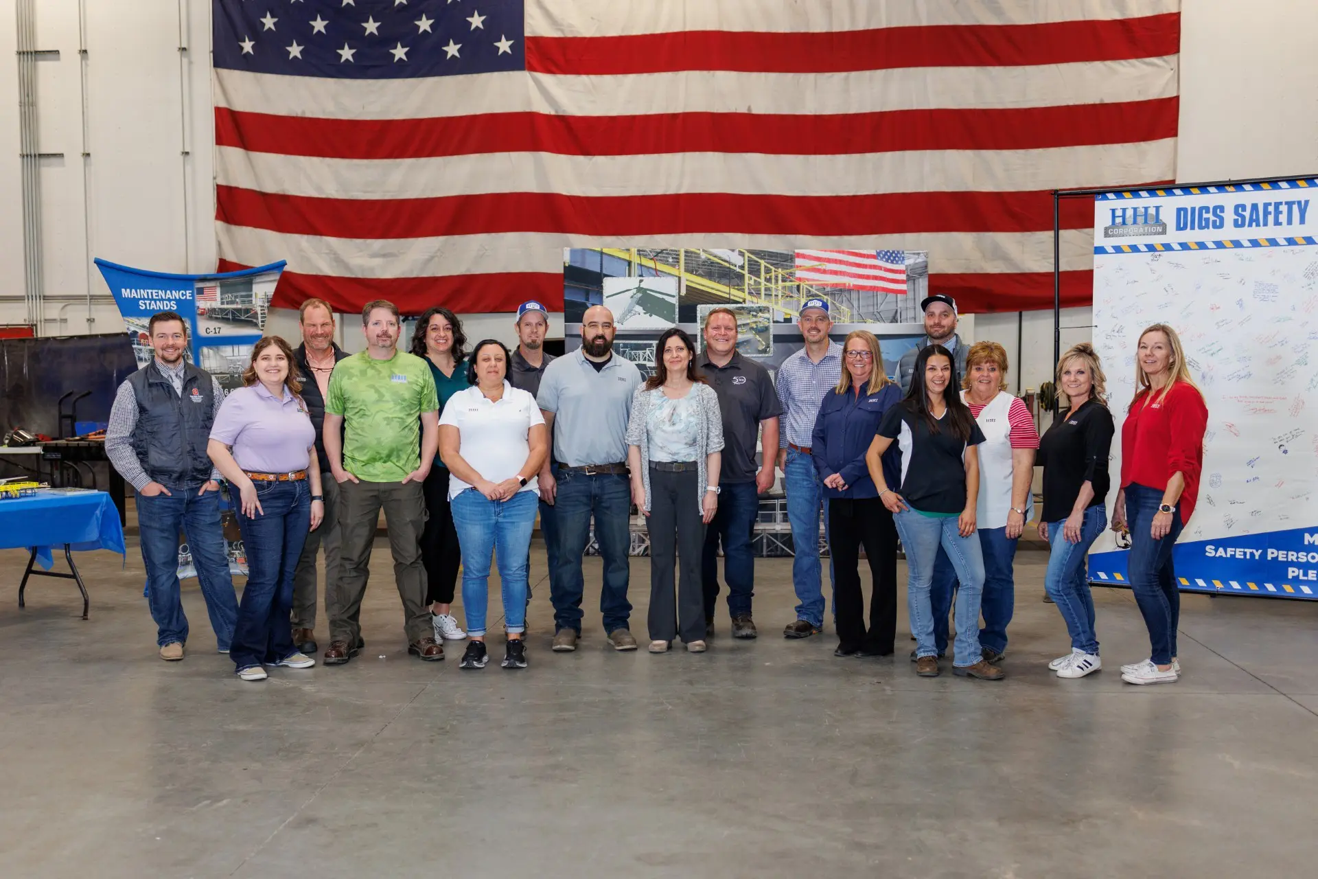 Group photo in front of American flag.