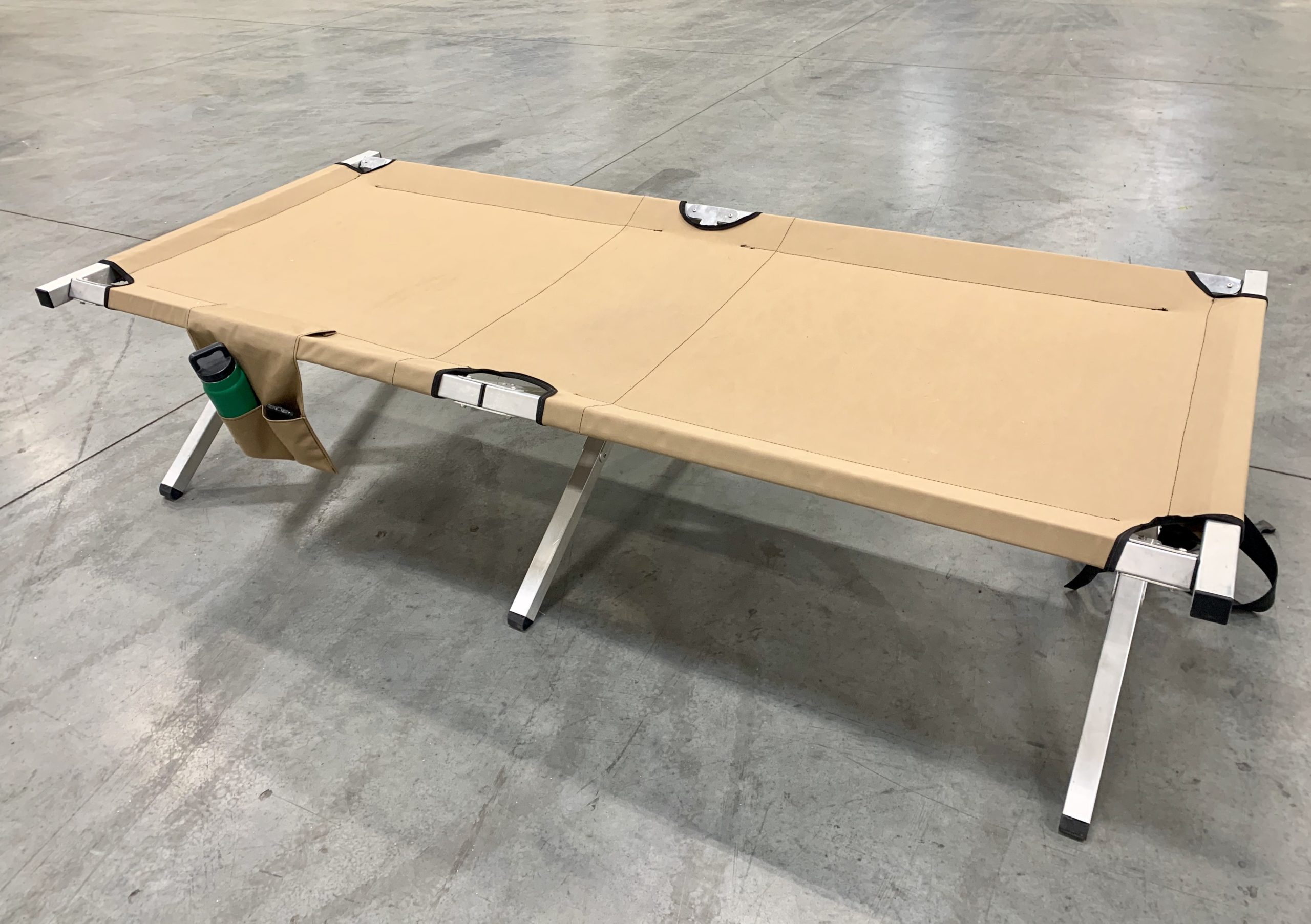 Lightweight portable cot with metal frame