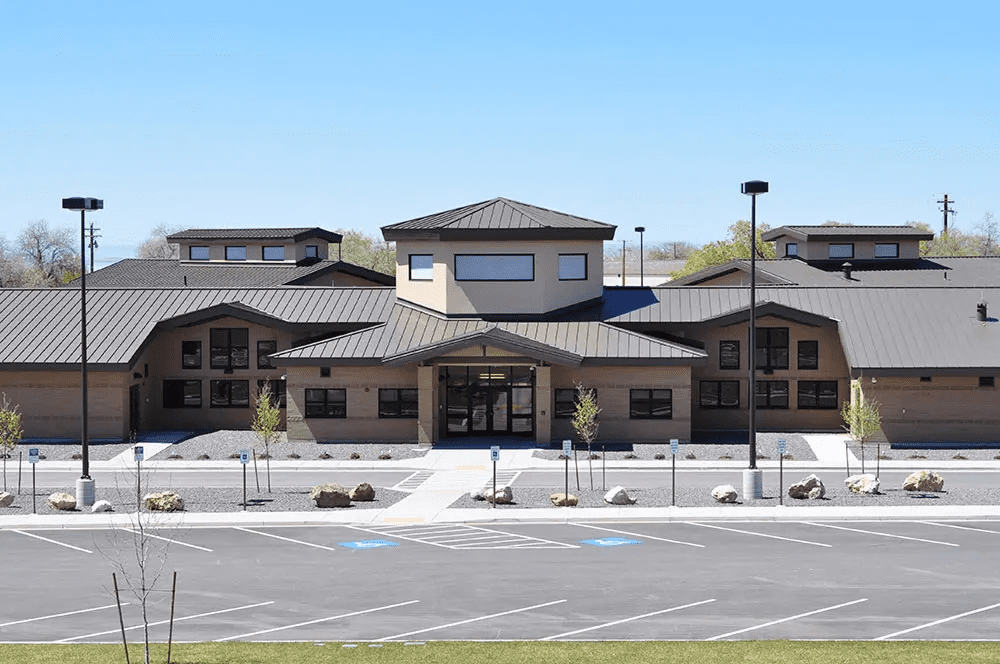 Modern building with empty parking lot.