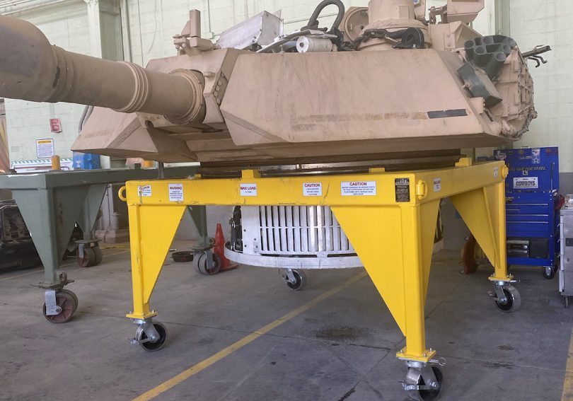 Military tank turret in maintenance facility