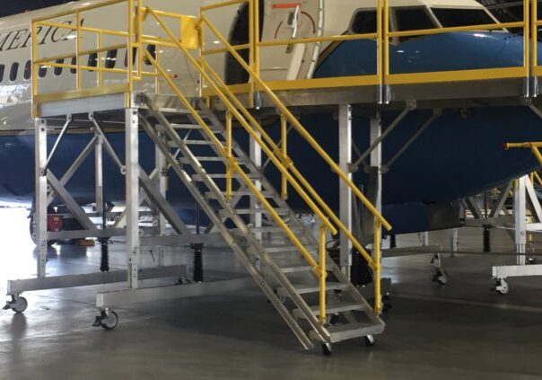 Aircraft in hangar with maintenance equipment